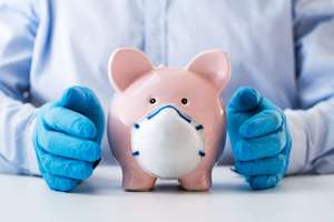 Human Hand Protecting Piggy Bank