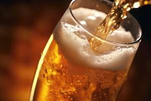 Closeup Of Beer Being Poured Into Glass