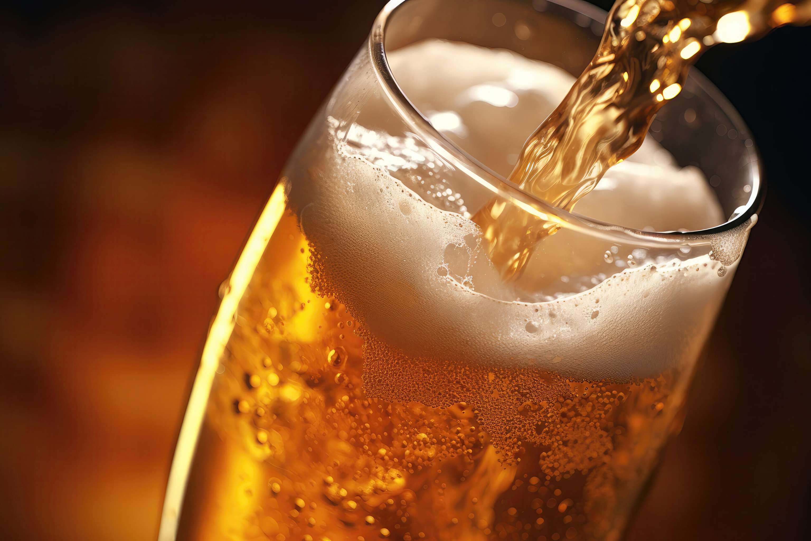 Closeup Of Beer Being Poured Into Glass