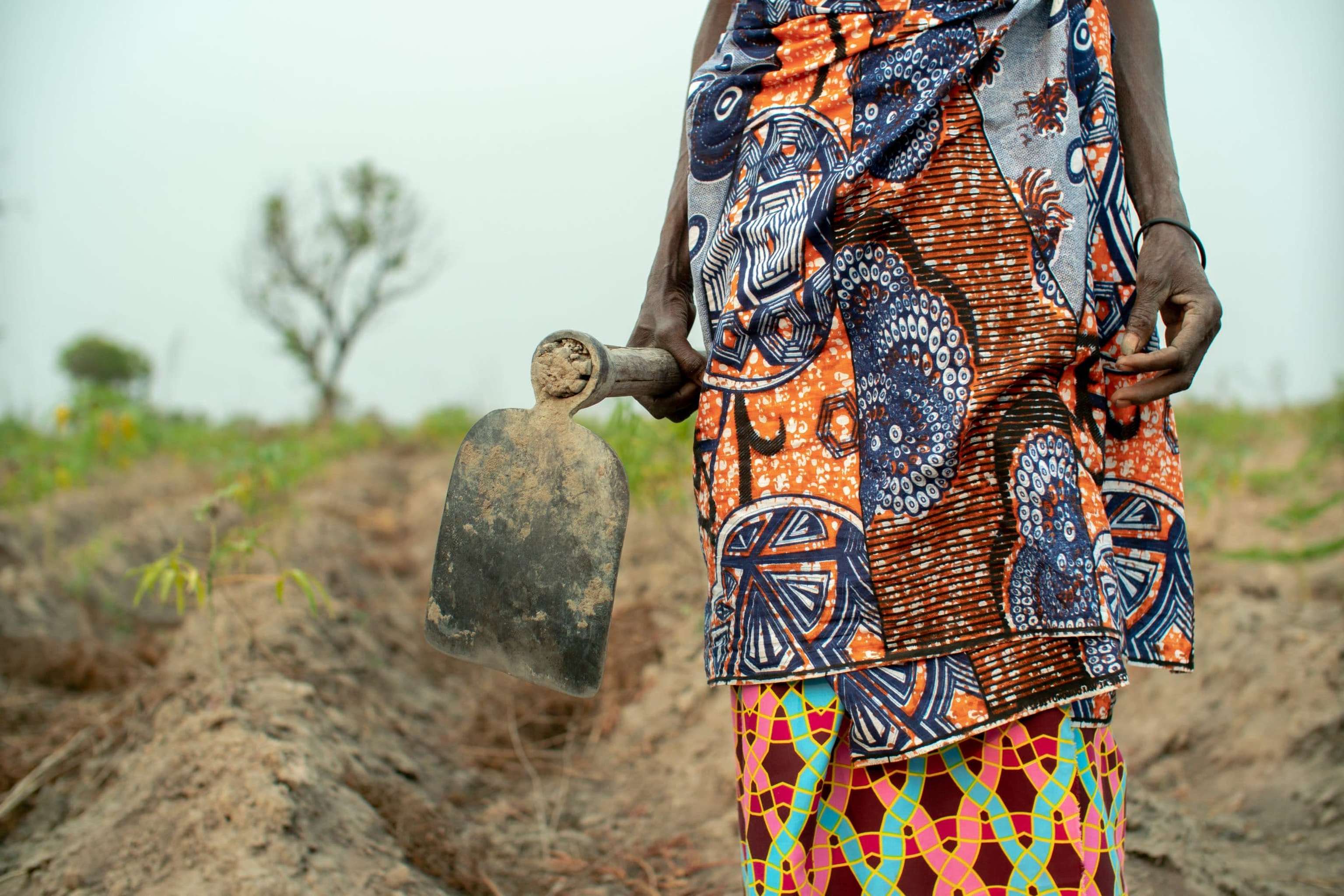 Local Farmer Dressed In Colorful African Cloths, Angola 2019.