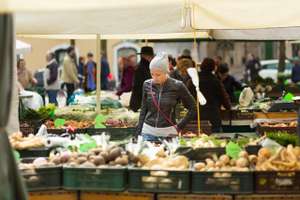 Woman Buying Vegetable At Local Food Market.