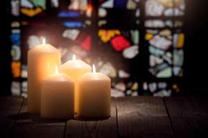 Candles Burning In A Church Background