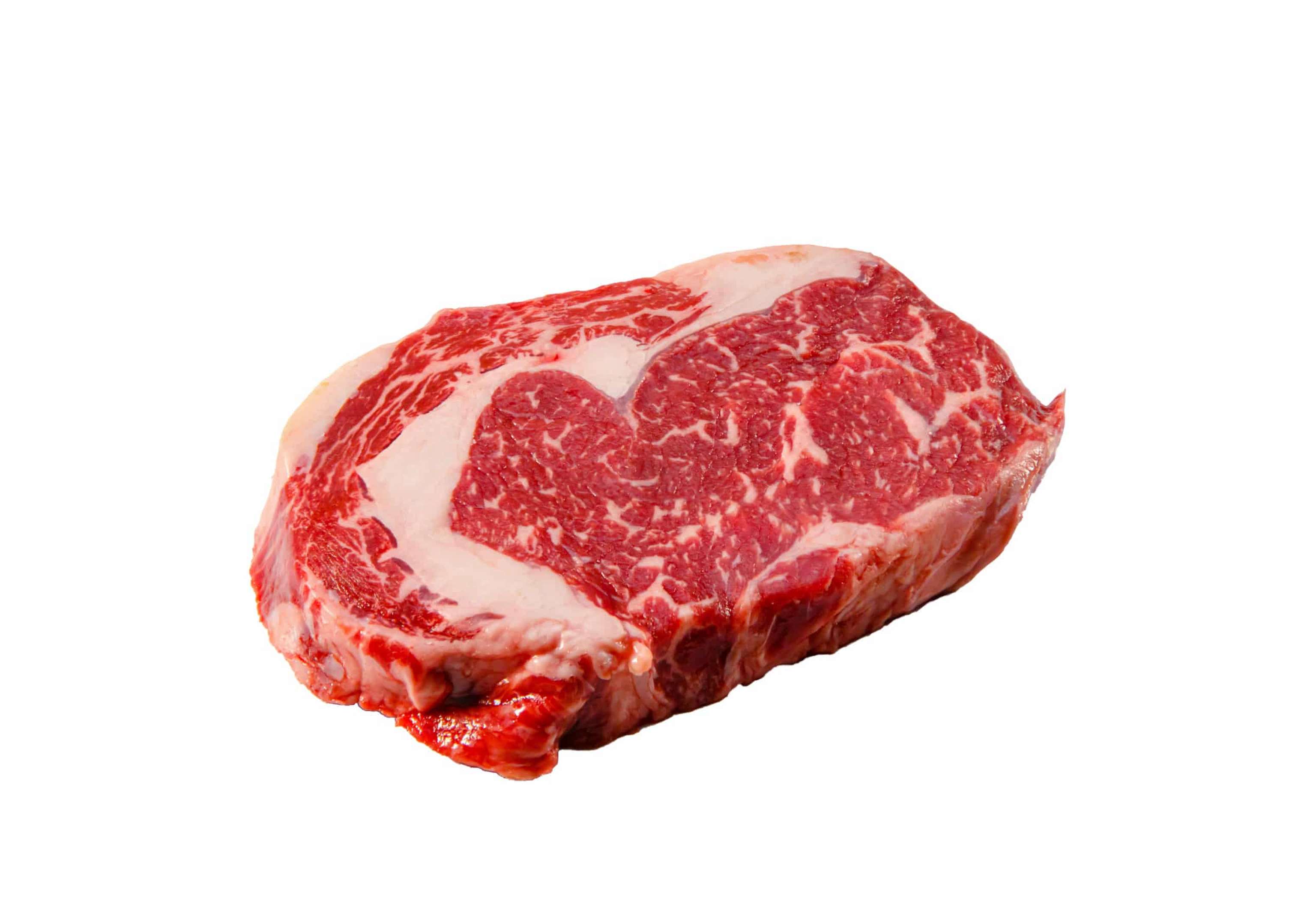 A Rib Eye Steak Of Marbled Grain Fed Beef Lies On A White Background. Isolated.