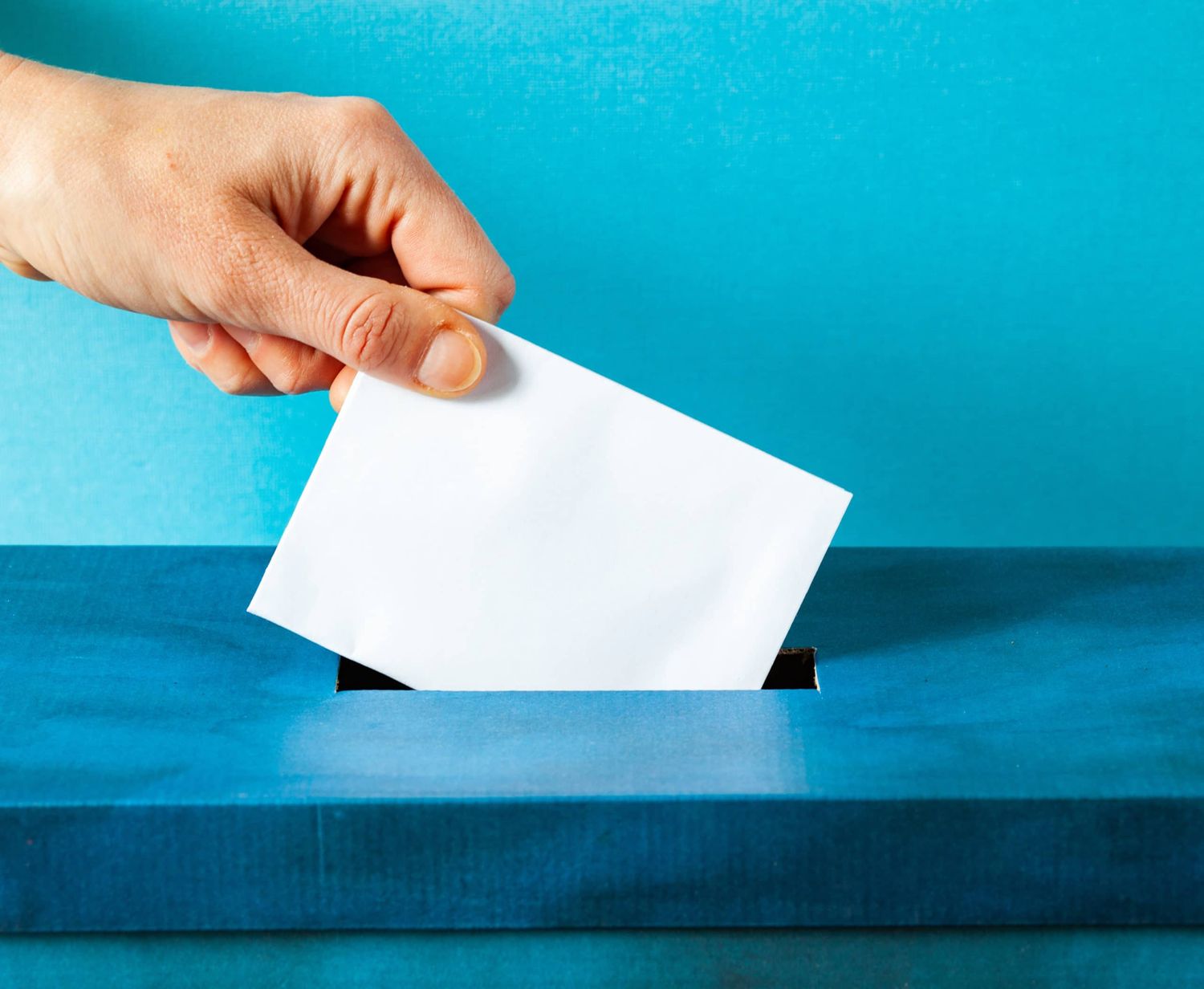 European Union Parliament Election Concept Hand Putting Ballot In Blue Election Box