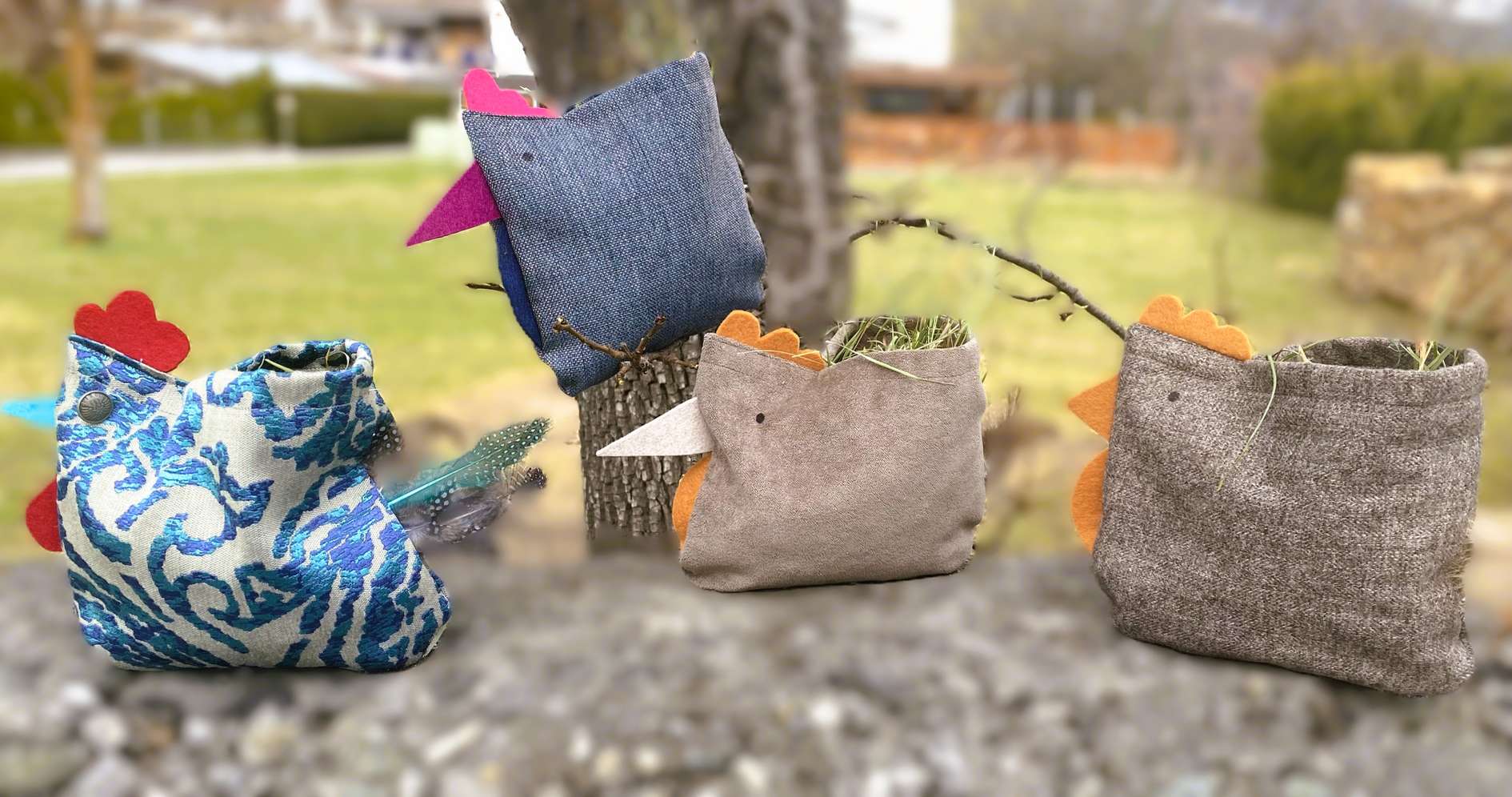 Handcrafted fabric chickens with various patterns and colors perched outdoors on a branch.