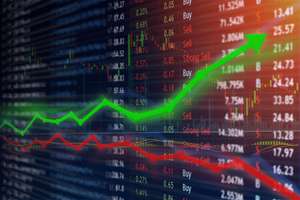 Investing And Stock Market Concept Gain And Profits With Faded Candlestick Charts.