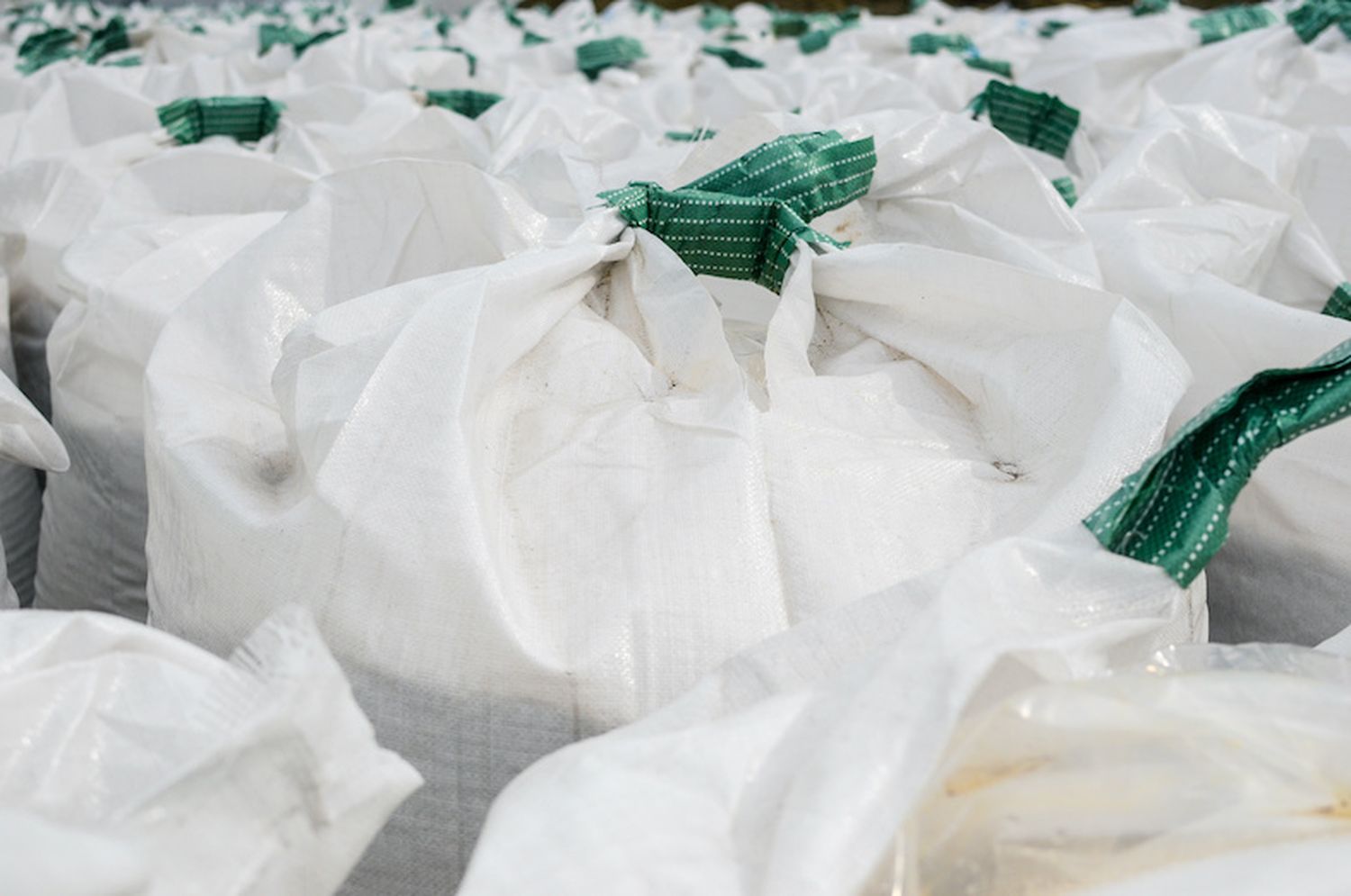 Many Jumbo Bags Piled With Urea Fertilizer Near The Factory.