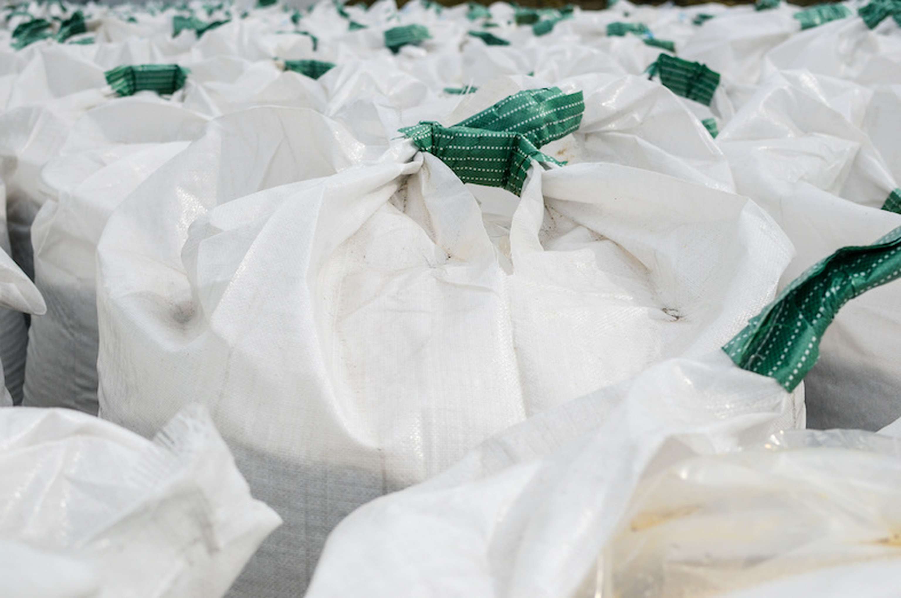 Many Jumbo Bags Piled With Urea Fertilizer Near The Factory.