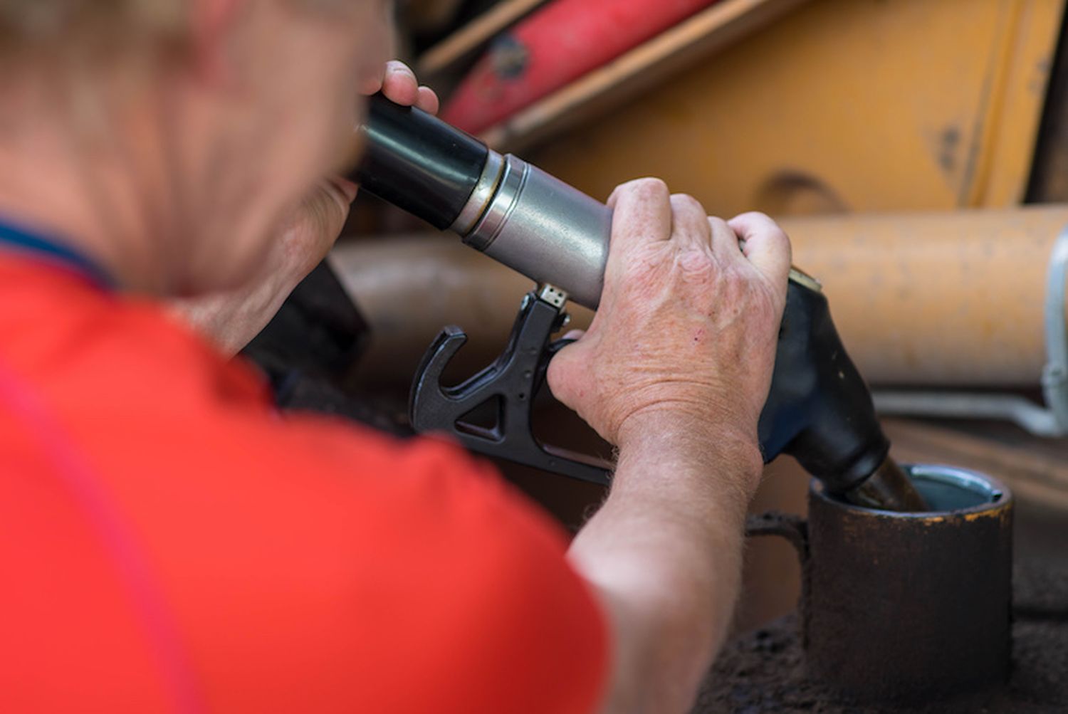 Man Refueling Tractor At The Gas Station. Pumping Petrol With Fuel Pump. Close Up.