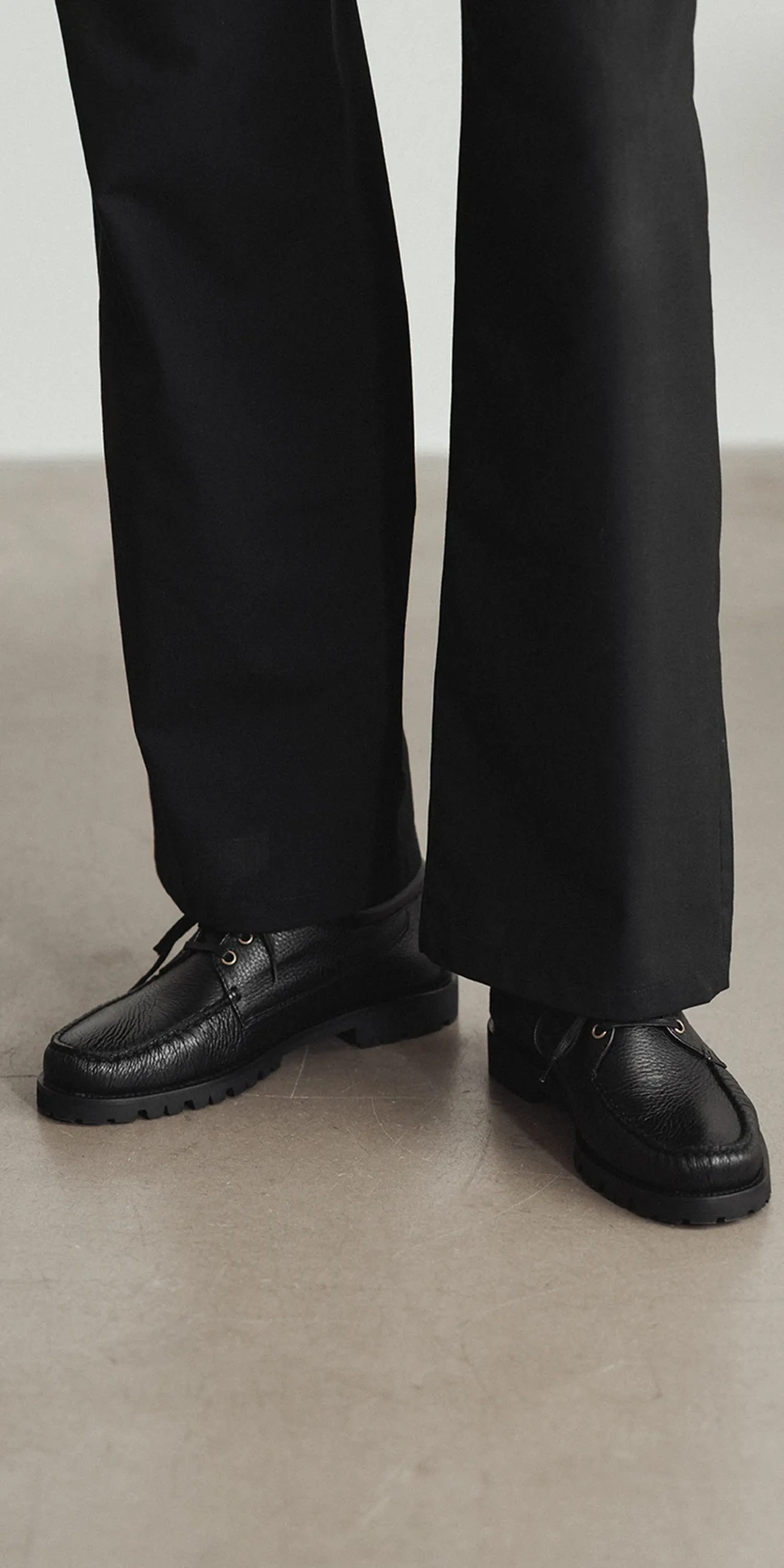 The Camp Moc black deerskin mobile