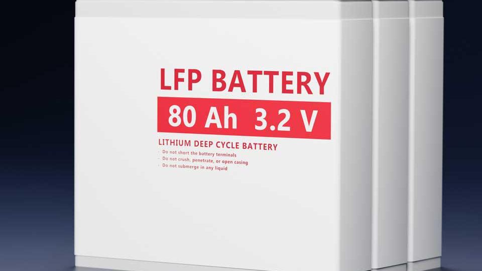White lithium deep cycle battery with red and black terminals, labeled "LFP BATTERY 80 Ah 3.2 V," featuring safety instructions.