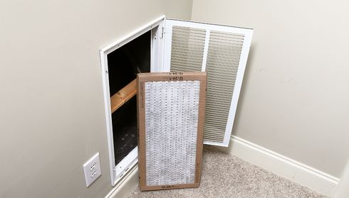 Checking and replacing central air conditioning filter