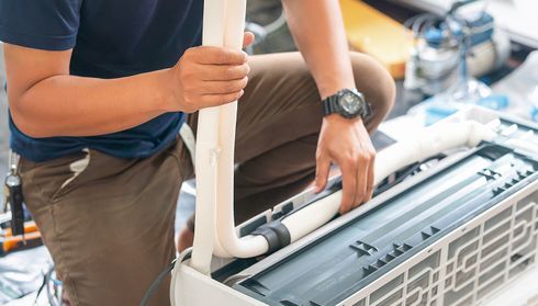Person installing an air conditioner