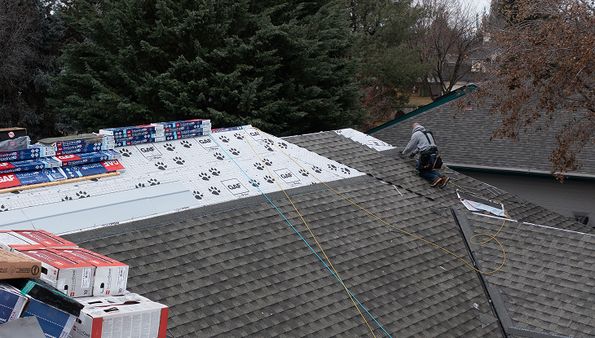 Asphalt shingle roof replacement with underlayment and new shingles
