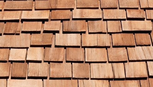 Close-up of overlapping cedar shingles on a roof