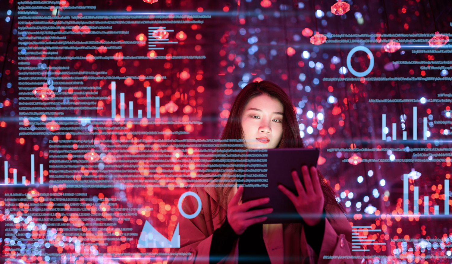 A woman uses a tablet surrounded by digital data visualizations and red lights, creating a futuristic and high-tech ambiance.