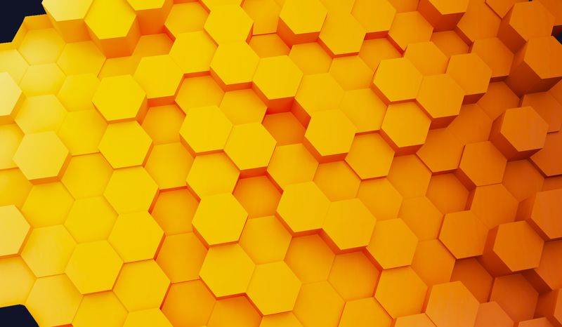 Close-up of a vibrant yellow honeycomb pattern with hexagonal shapes, creating a textured and geometric abstract design.