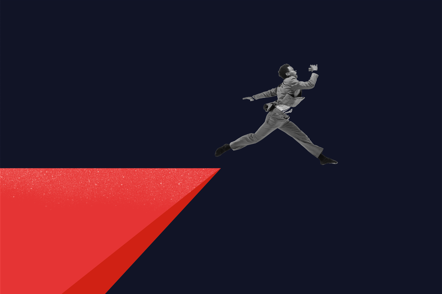 A person in a suit leaps across a red triangular gap against a dark background, symbolizing ambition and challenge.