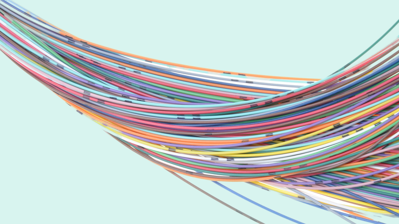 A swirl of colorful, intertwined cables against a light blue background, showcasing shades of red, orange, green, blue, and purple.