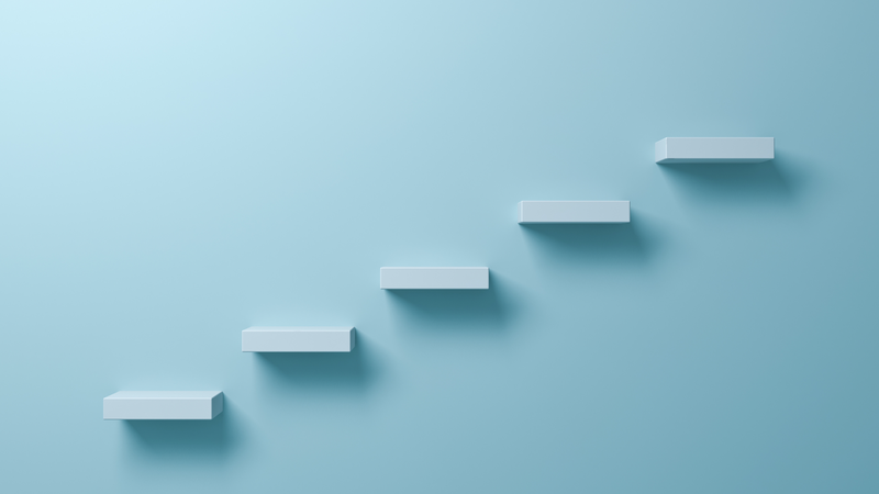 Minimalist 3D rendering of white floating steps ascending diagonally against a light blue background.