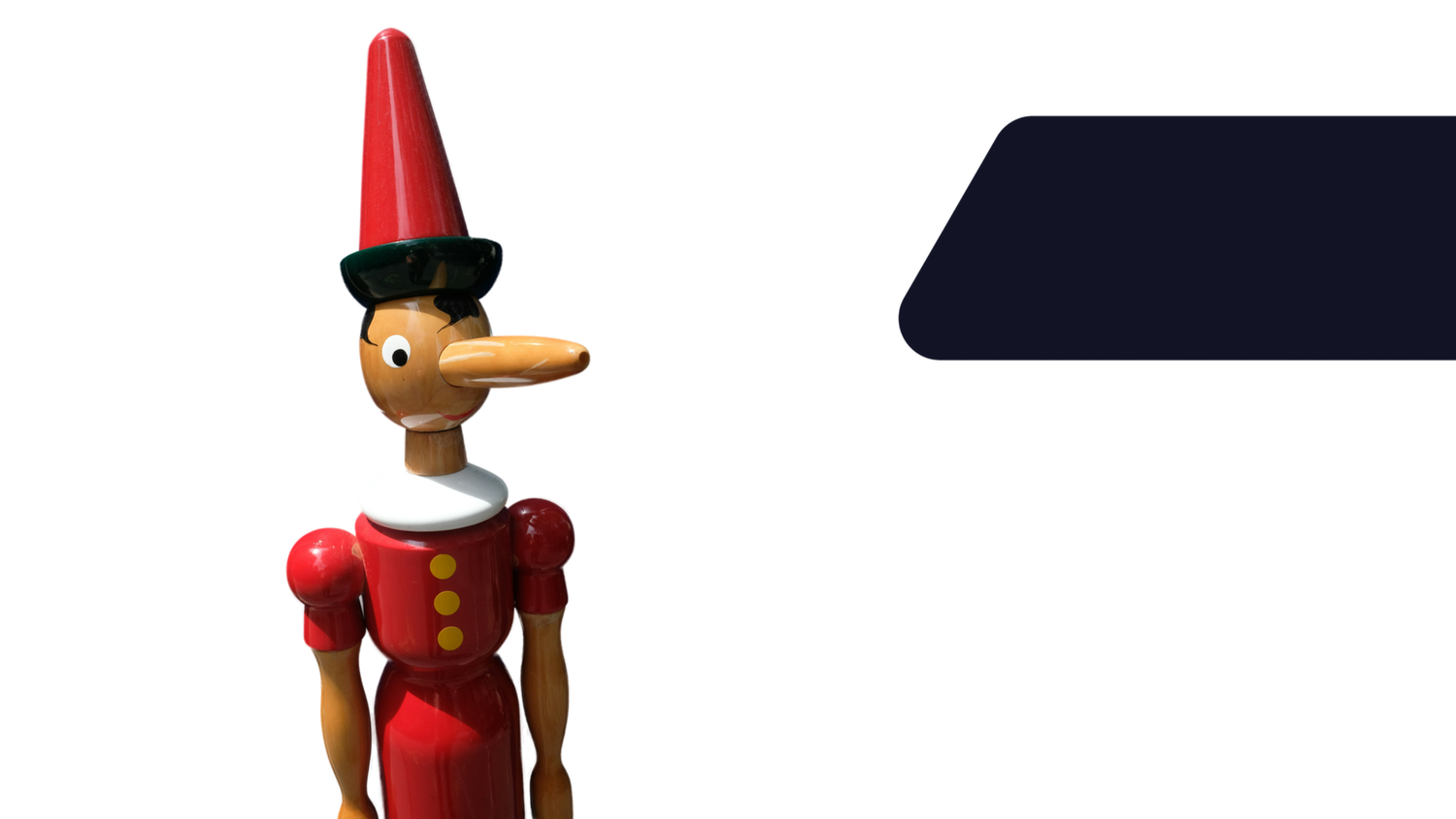 Wooden Pinocchio figure in a red outfit with a long nose and tall red hat, standing against a white background with a dark geometric shape.