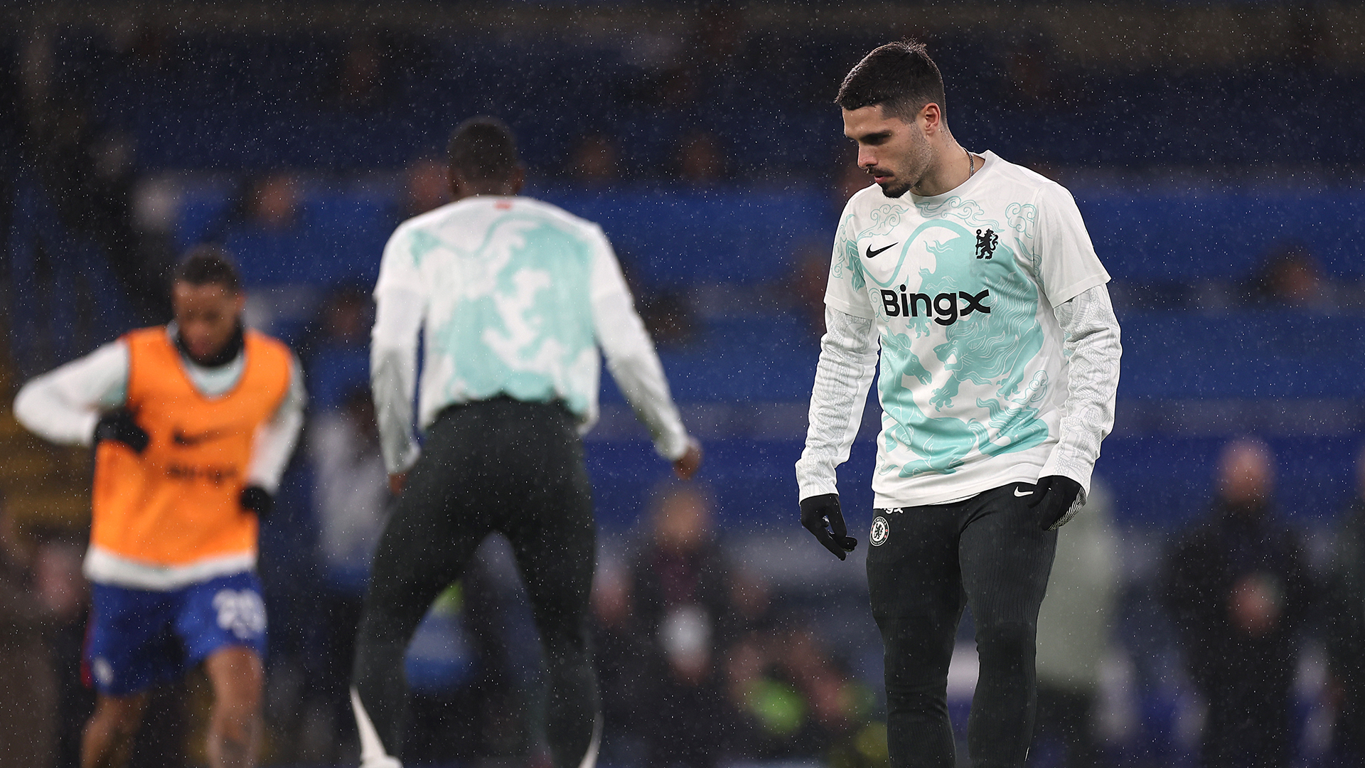 Pedro Neto warming up in the special Chelsea lunar new year shirt 2026
