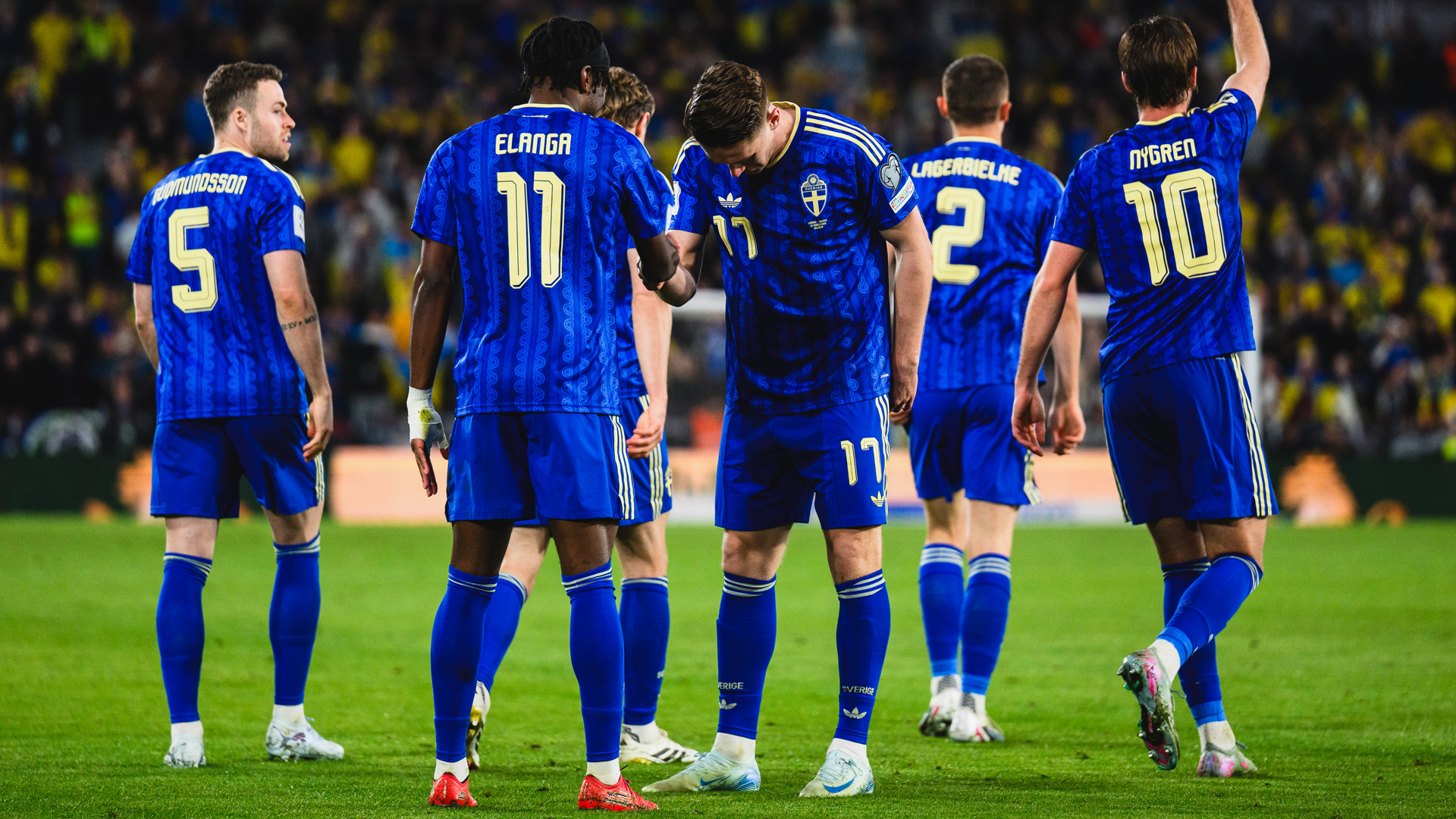 Anthony Elanga and Viktor Gyokeres celebrating a goal wearing Sweden's 2026 away shirt