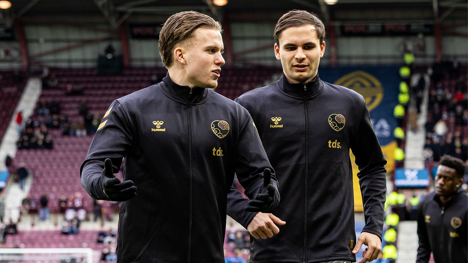 Hearts players warm-up wearing a special Lunar New Year jackets