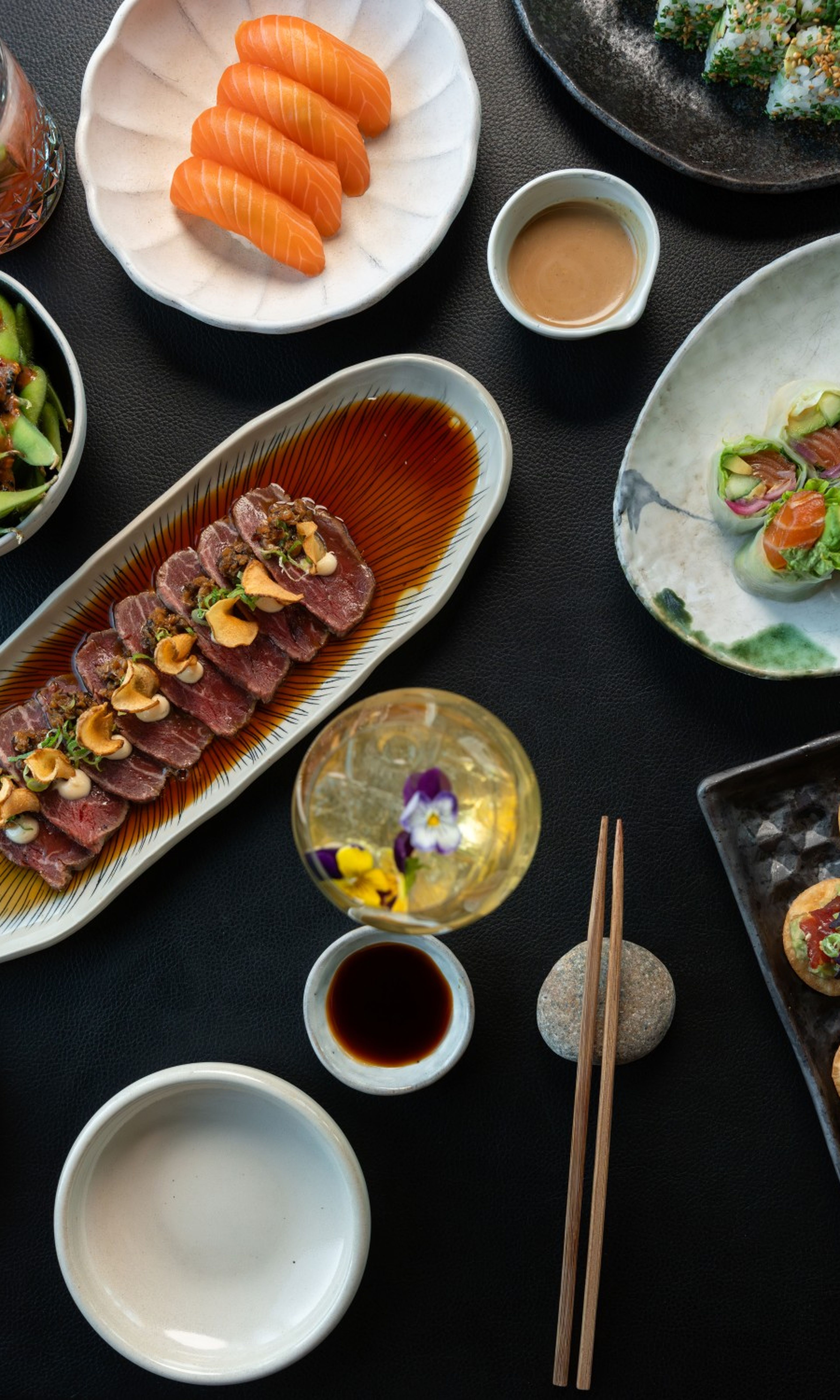 Group of young people enjoying bottomless drinks and a Japanese brunch