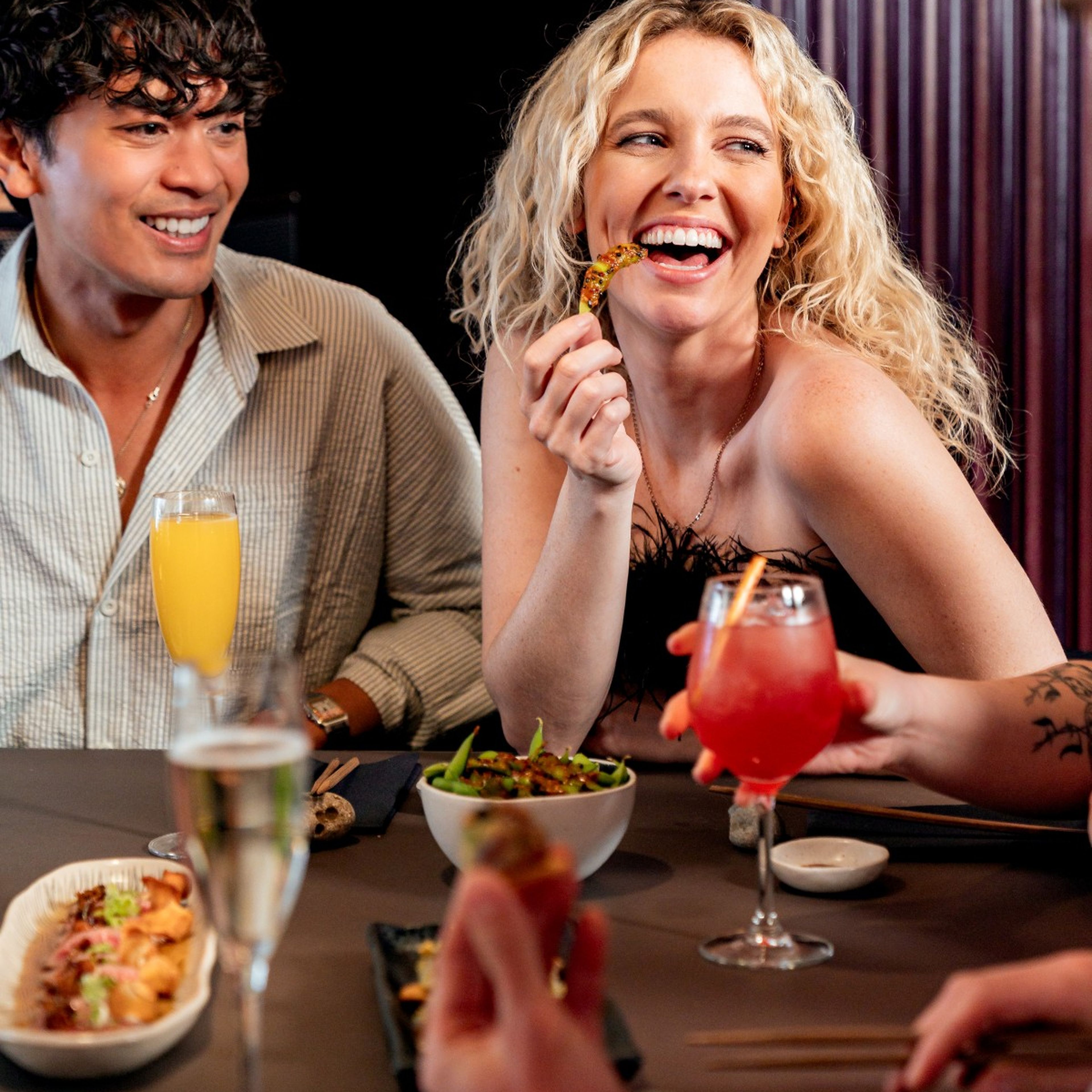 Group of young people enjoying bottomless drinks and a Japanese brunch