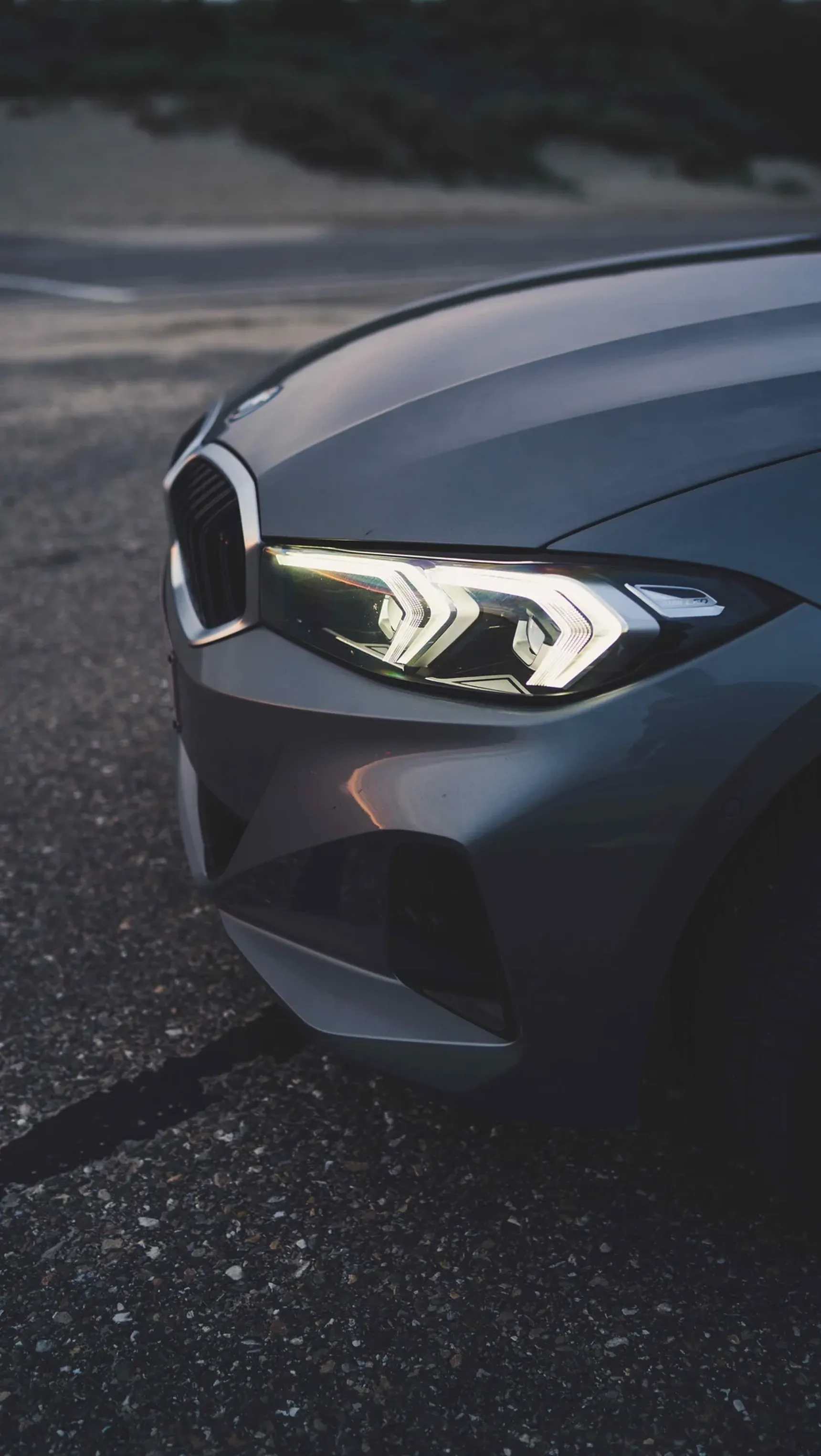 2024 BMW 320e Touring iPhone background headlight detail