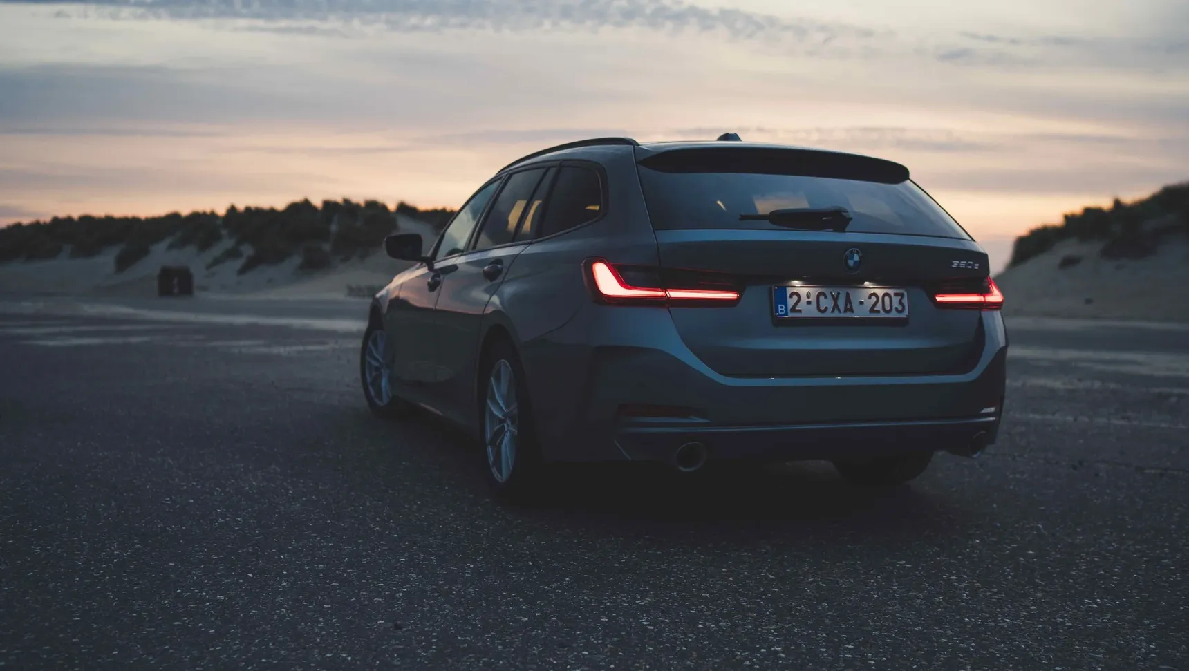 2024 BMW 320e Touring rear beach sunset