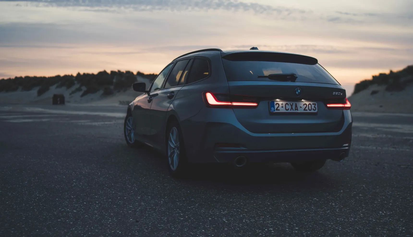 2024 BMW 320e Touring rear beach sunset