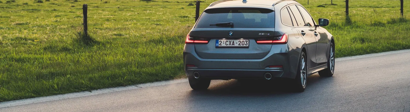 2024 BMW 320e Touring rear sunset