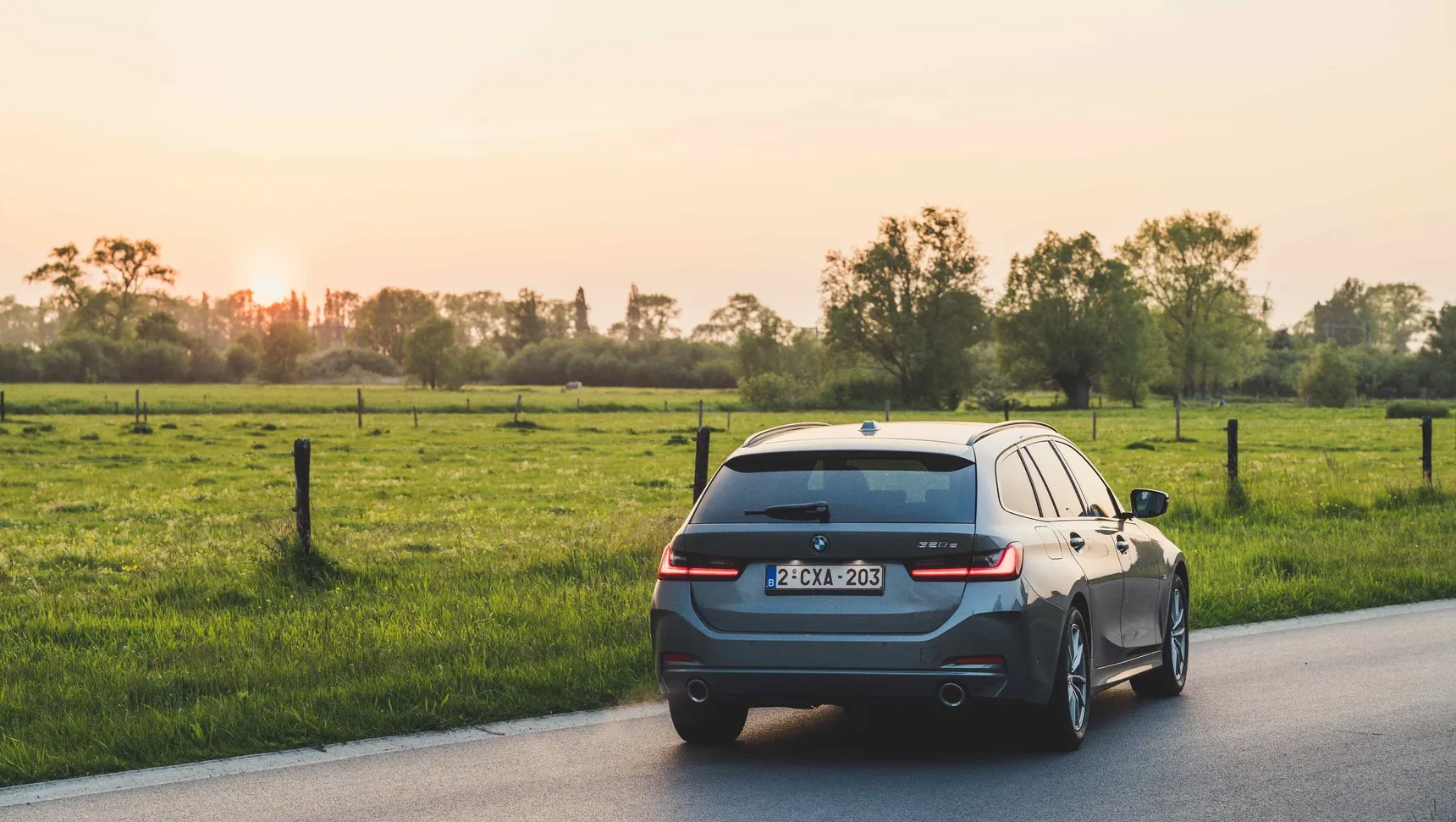 2024 BMW 320e Touring rear sunset