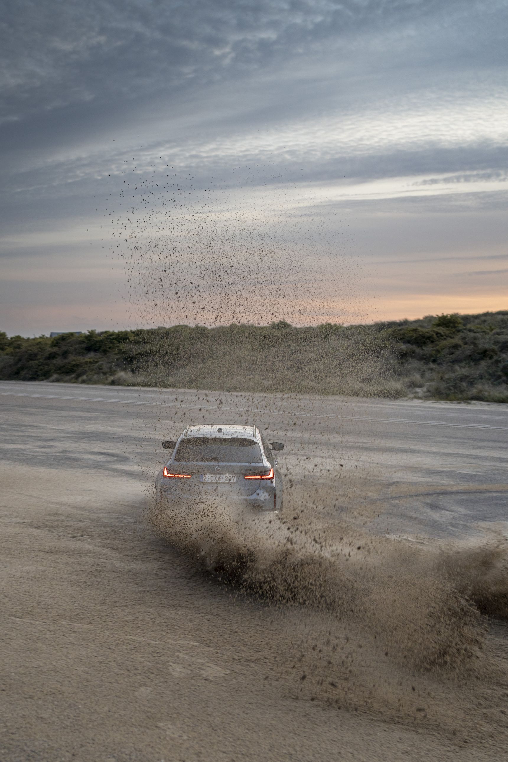 2023 BMW M3 Touring drifting sand sunset iphone background
