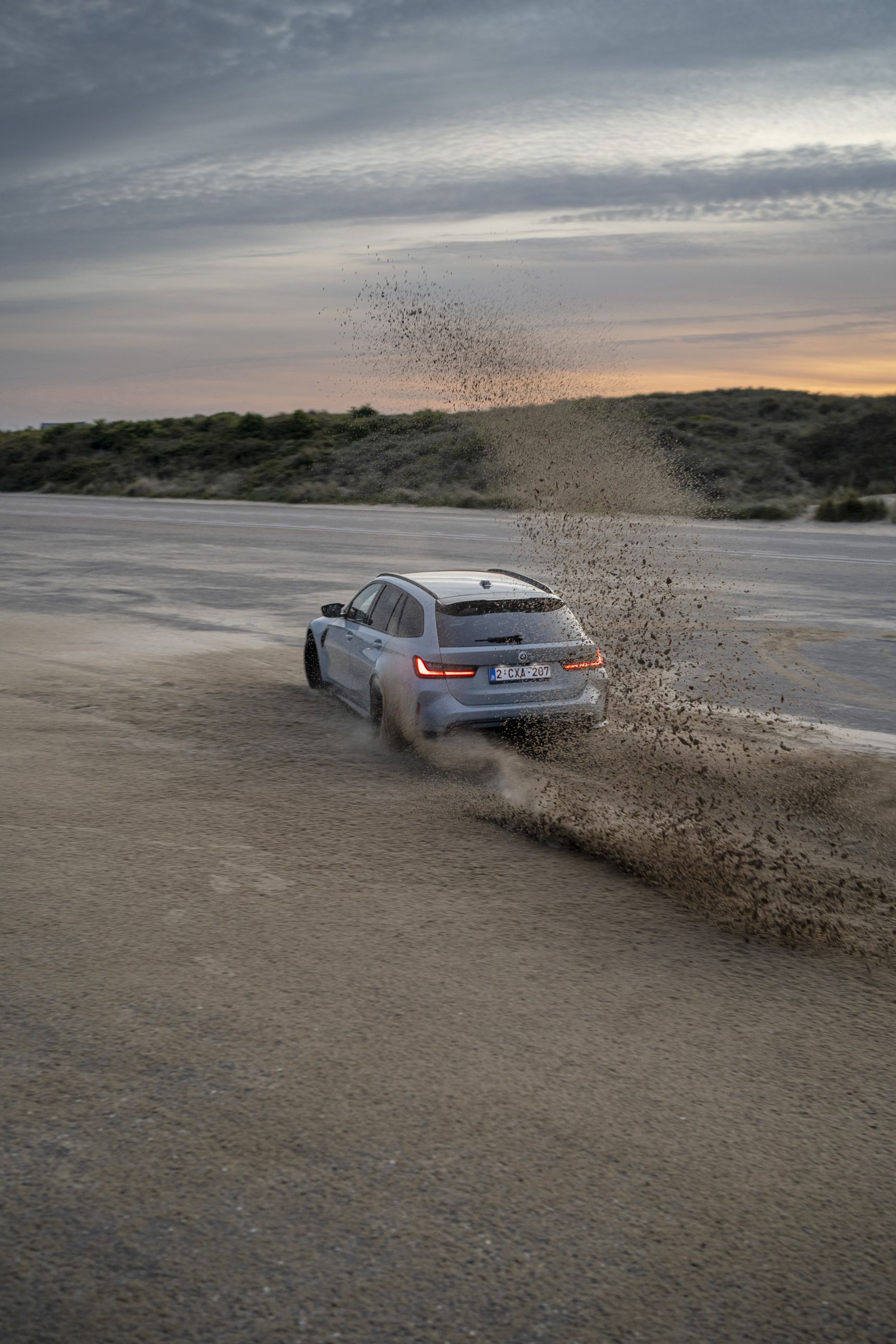 2023 BMW M3 Touring drift sand iphone background