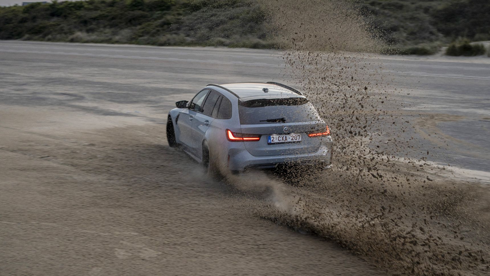 2023 BMW M3 Touring drift sand iphone background