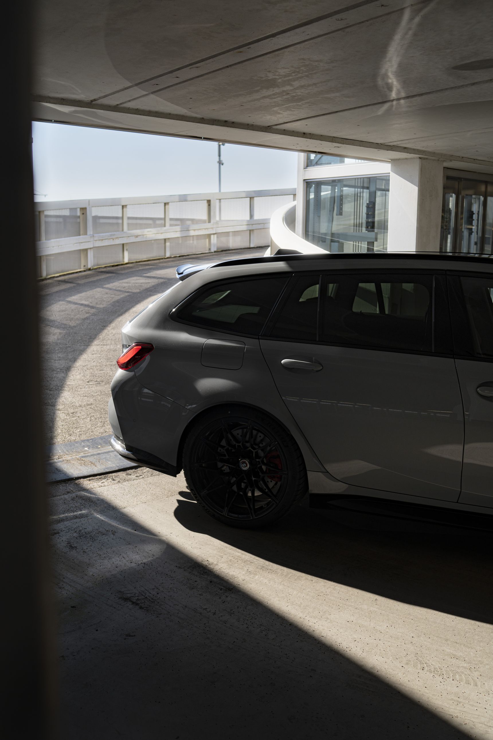 2023 BMW M3 Touring rear side iphone background shadows