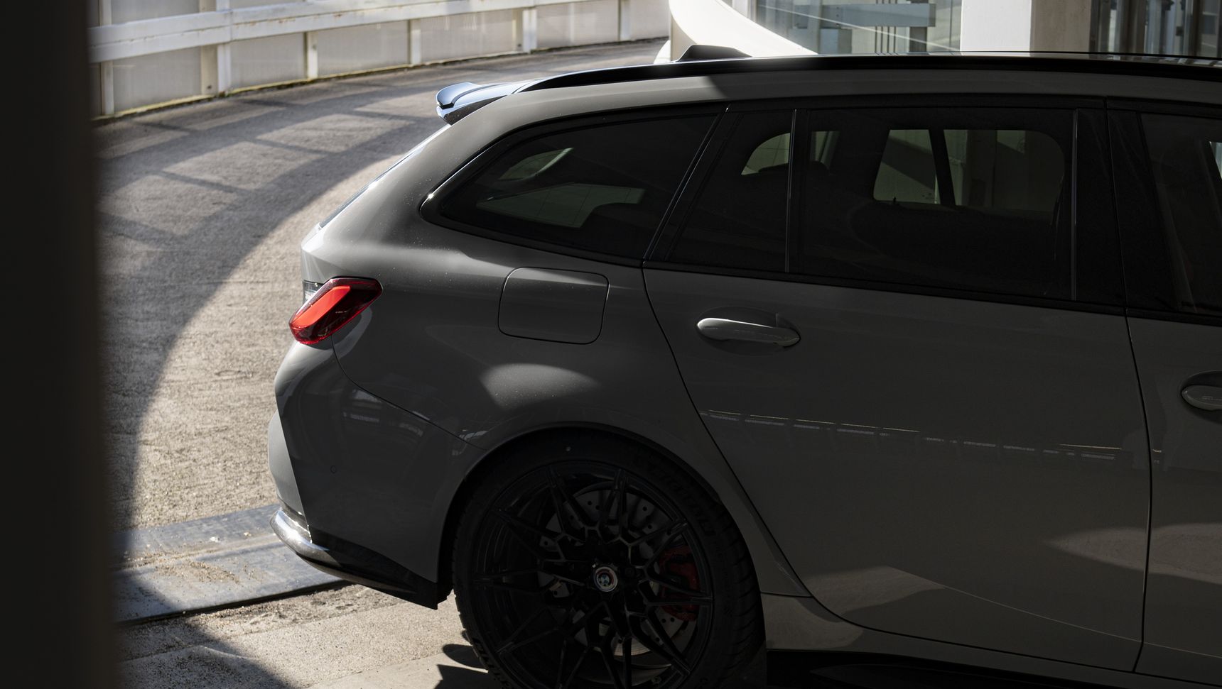 2023 BMW M3 Touring rear side iphone background shadows