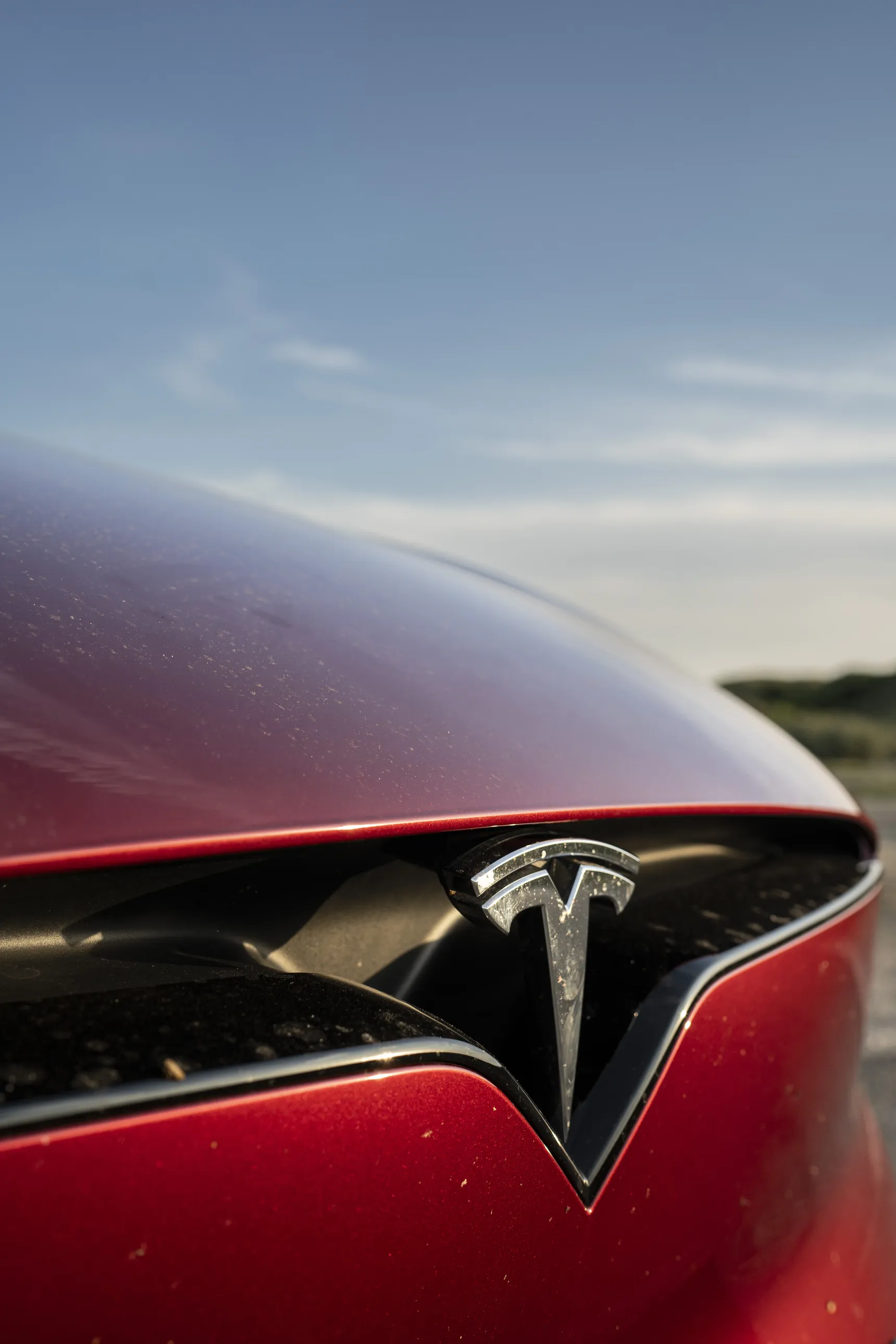 2024 Tesla Model X Long Range Red logo front iphone background