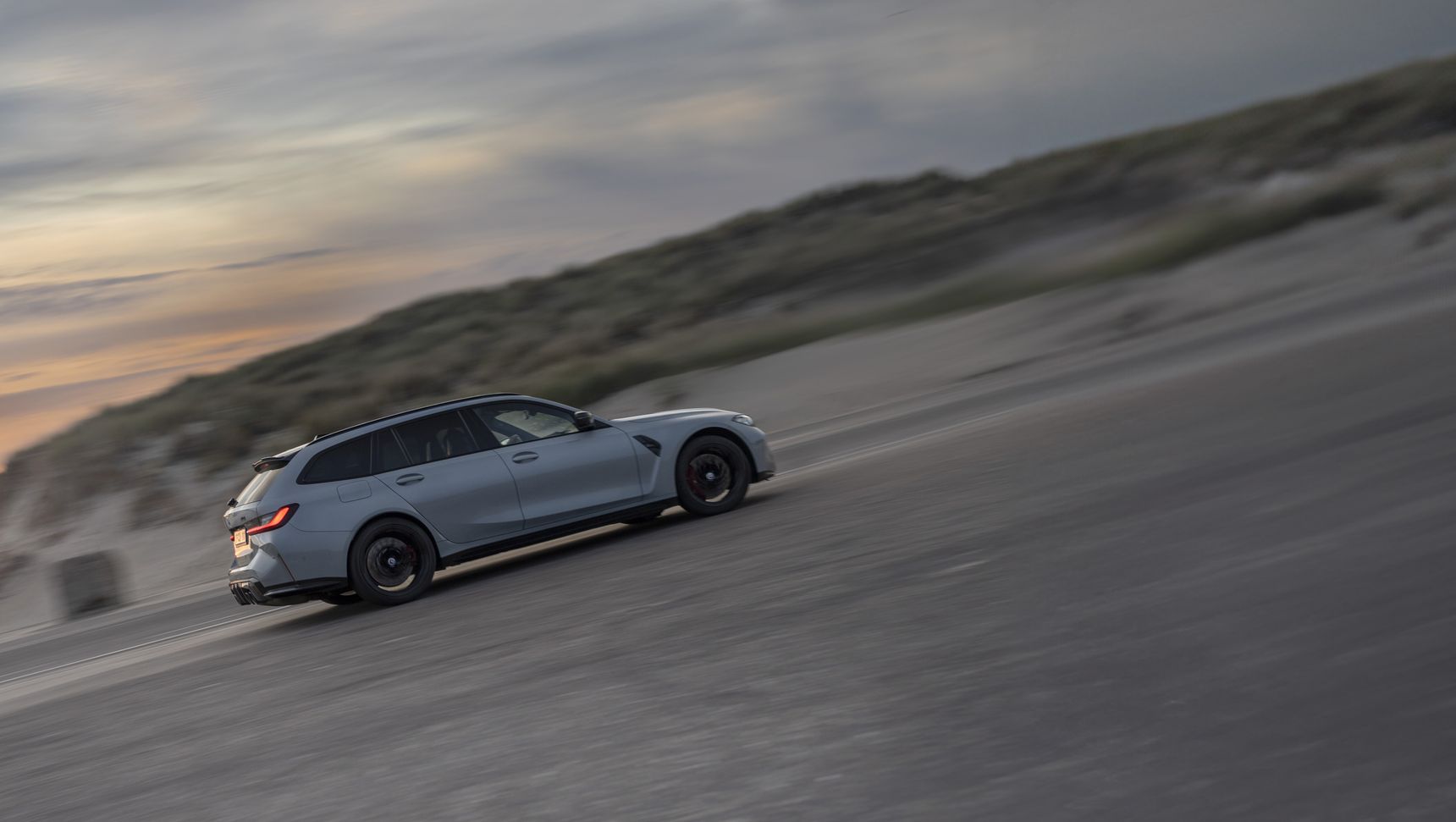 2023 BMW M3 Touring panning rolling side fast