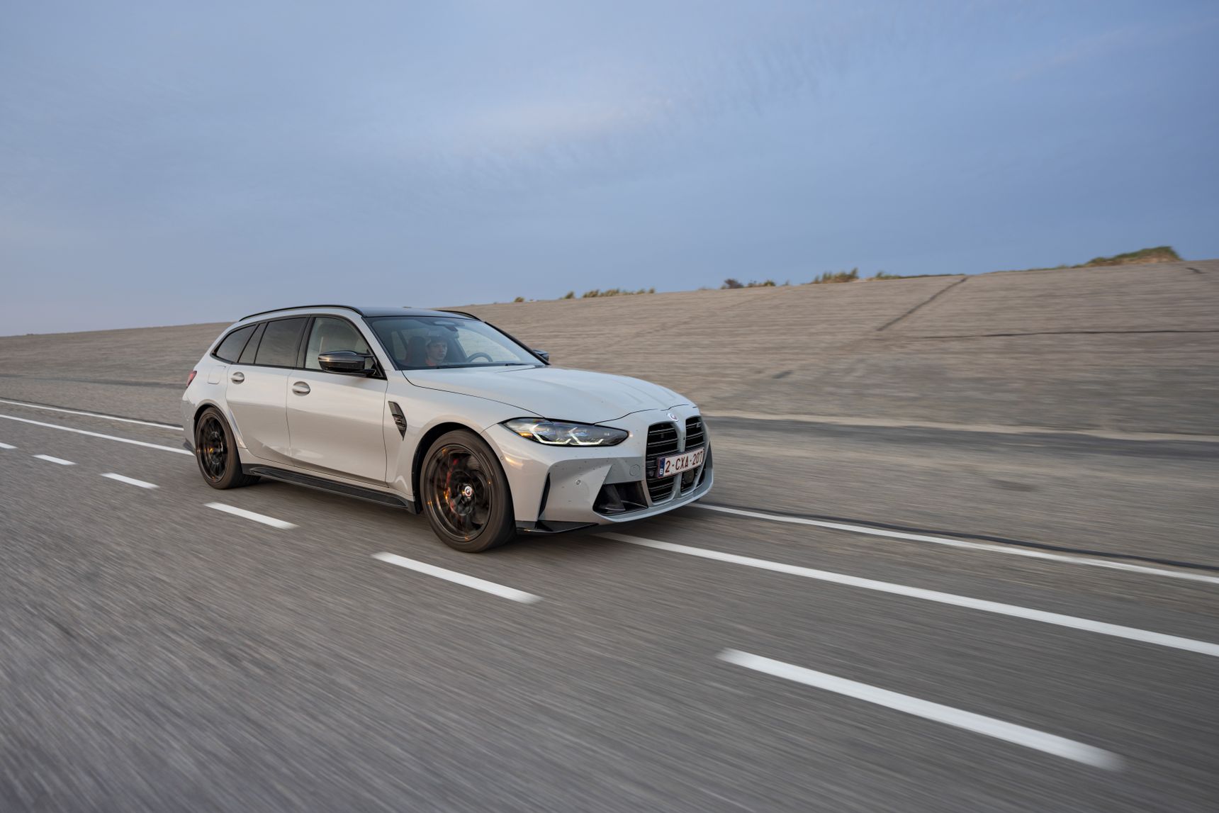2023 BMW M3 Touring driving rolling shot side
