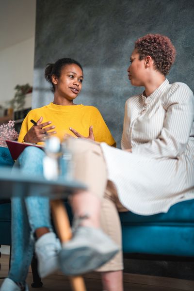 Mid Adult Woman and Female Nutritionist