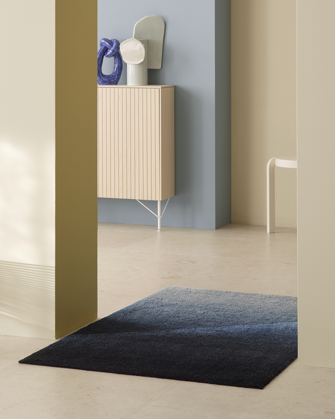 Heymat Dis Fjord doormat styled in a calm, design-forward home