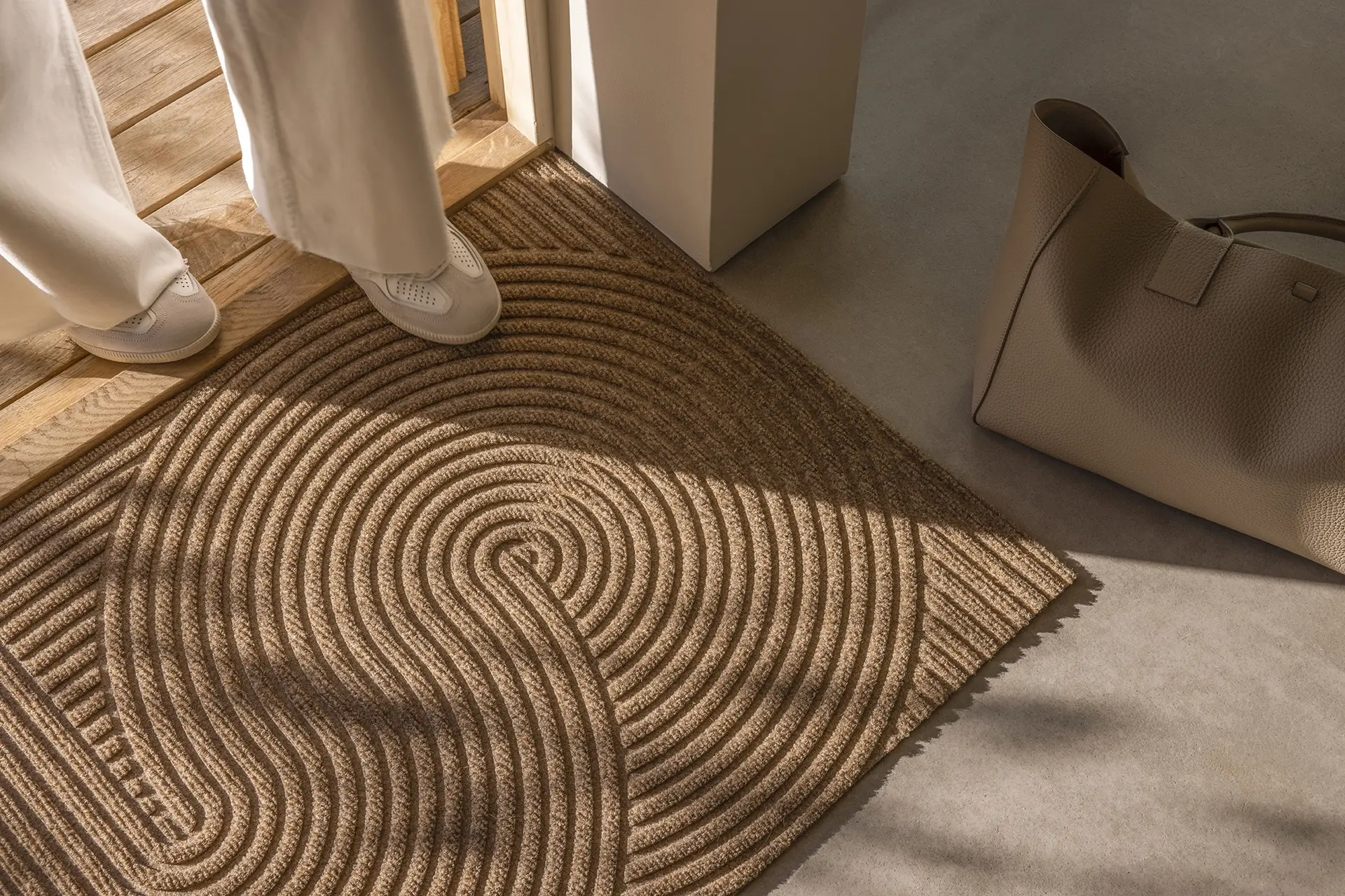 Heymat Sand doormat placed at a home entrance, trapping dirt and moisture