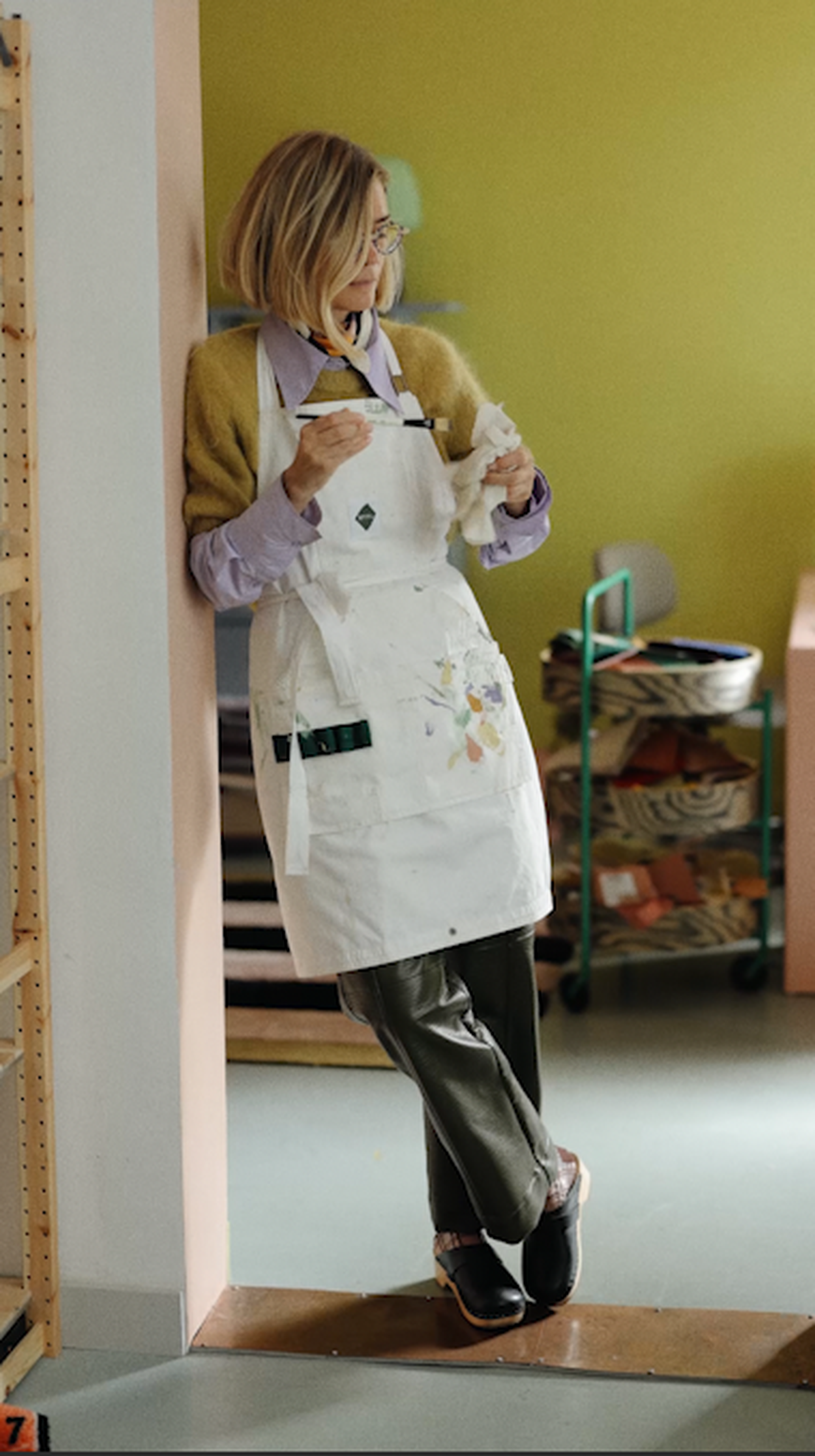 Tekla Evelina Severin standing in doorway with painting brush