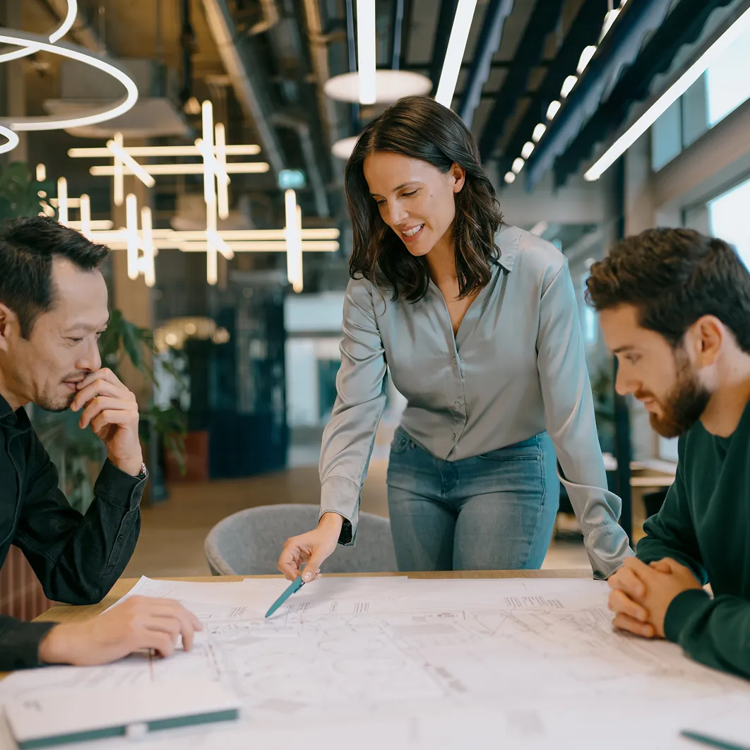 Three people working in office