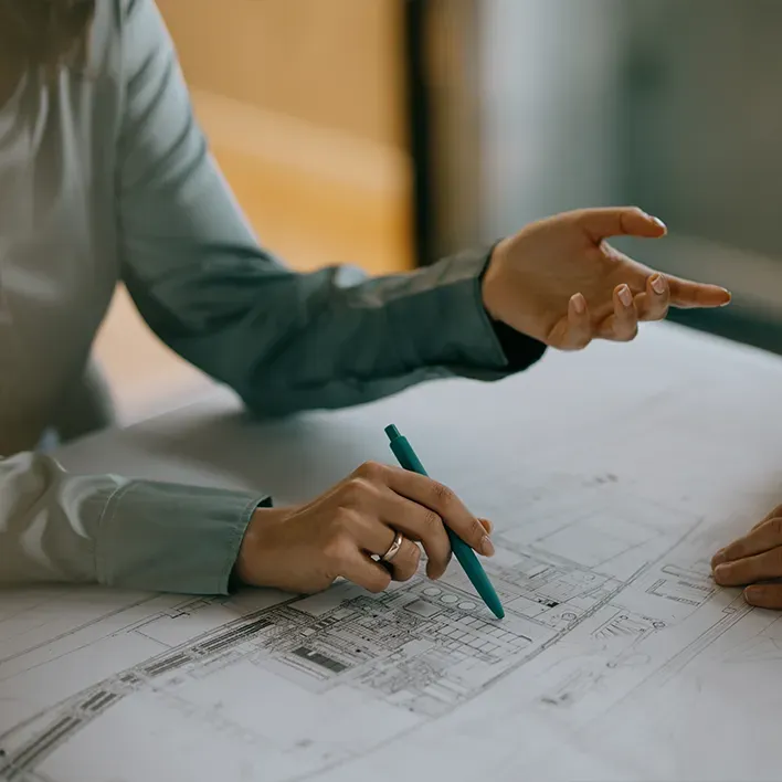 Detail on a plan pointed by hand