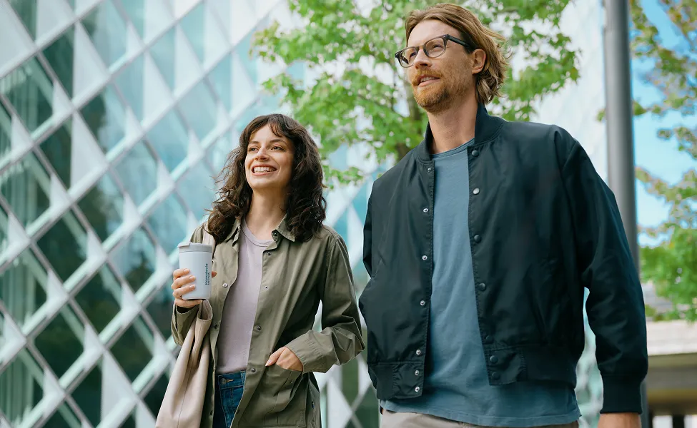 Two people walking outside